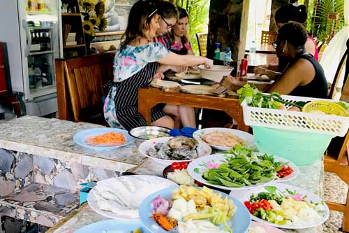Ingredients and students preparing Thai food